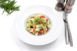 Salad with chicken breast Simple, herbs, cutlery, and salt and pepper