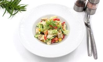 Salad with chicken breast Simple, herbs, cutlery, and salt and pepper