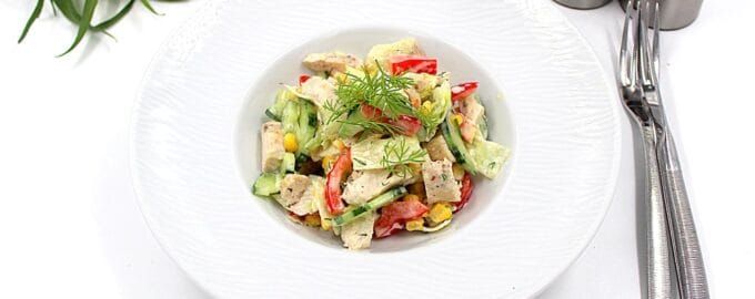 Salad with chicken breast Simple, herbs, cutlery, and salt and pepper