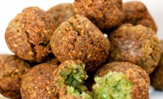 This is a close-up of golden-brown falafel balls,gluten-free texture.