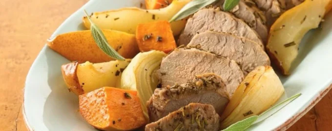 Gluten-free rosemary roasted pork with potatoes and vegetables on a plate