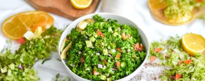 Cauliflower-based grain-free tabbouleh salad with fresh herbs and vegetables