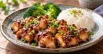Japanese chicken teriyaki with rice, broccoli, sesame seeds, and scallions