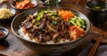 Korean beef bulgogi rice bowl with vegetables and kimchi